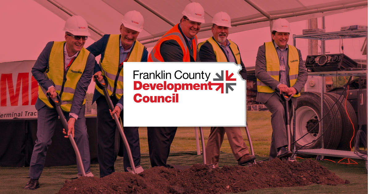 The FCDC homepage comp: a groundbreaking photo of men in hard hats and hi-vis vests with shovels, a red 'OTTAWA & FRANKLIN COUNTY JUST CLICKS' hero, four value-prop tiles, and a green 'YOUR SNAP SHOT FOR SUCCESS' call to action.