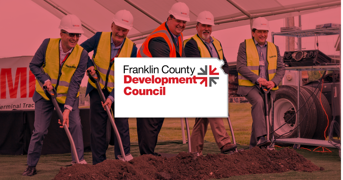 The FCDC homepage comp: a groundbreaking photo of men in hard hats and hi-vis vests with shovels, a red 'OTTAWA & FRANKLIN COUNTY JUST CLICKS' hero, four value-prop tiles, and a green 'YOUR SNAP SHOT FOR SUCCESS' call to action.