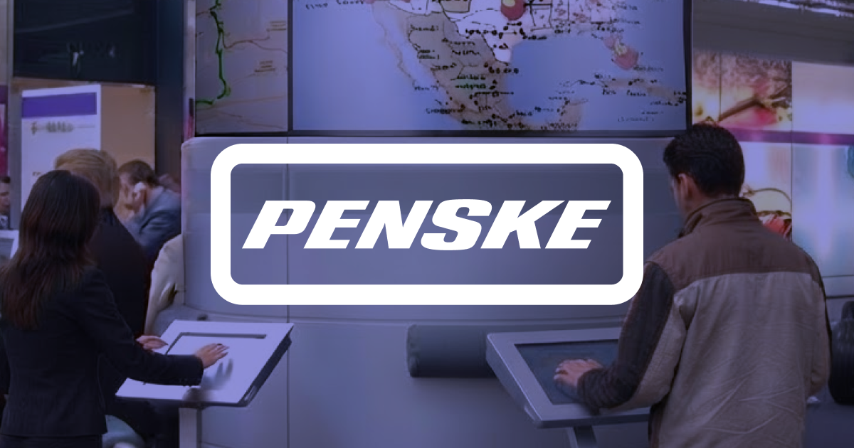 Concept image of visitors at touchscreen kiosks beneath a truck-tracking map, with the Penske logo overlaid.