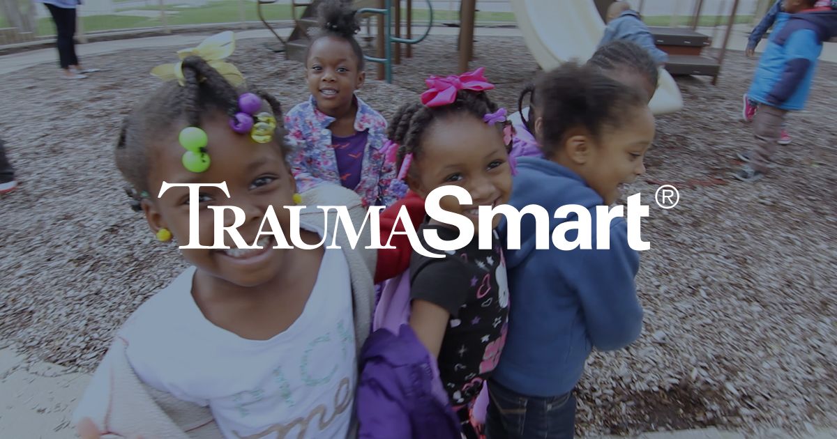 The Trauma Smart Treatment Guide cover: a young boy in a Kansas City hoodie reading with a young woman leaning in beside him, the TraumaSmart wordmark, and the Crittenton Children's Center / Saint Luke's lockup.