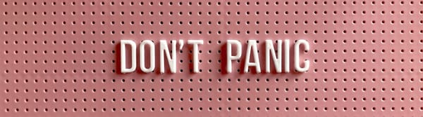 Pegboard text that reads, "Don't Panic."